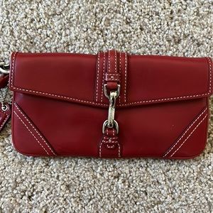 Deep red leather Coach wristlet